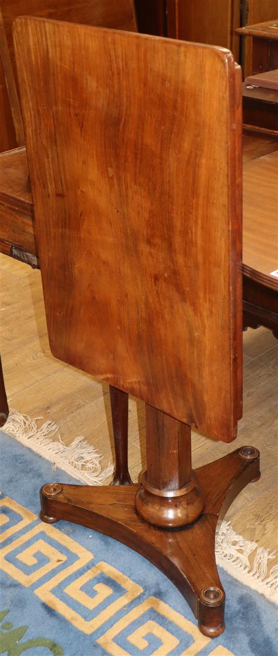 An early Victorian rosewood centre table of rectangular form on pillar and platform base W.68cm